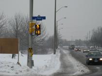 At this Dazé intersection, pedestrian countdown signal heads provide valuable information to pedestrians and drivers